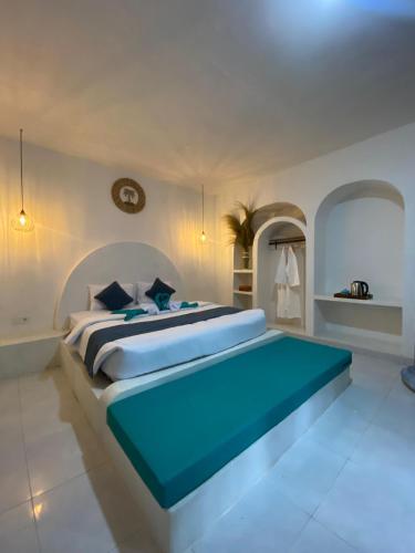 a large bedroom with a large bed in a room at Alaya at volcano in Baturaja