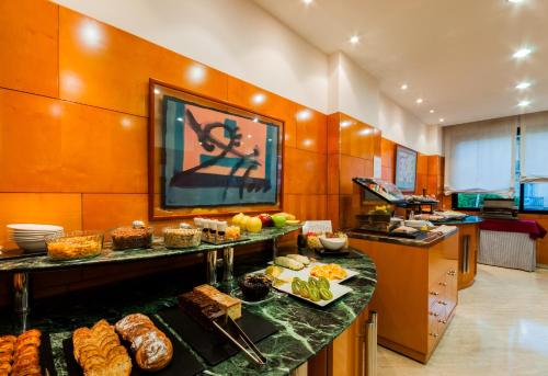 a kitchen filled with lots of different types of food at Hotel Villacarlos in Valencia