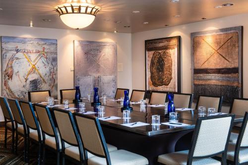 a conference room with a long table and chairs at La Posada De Santa Fe, a Tribute Portfolio Resort & Spa in Santa Fe