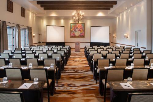 a large room with tables and chairs in it at La Posada De Santa Fe, a Tribute Portfolio Resort & Spa in Santa Fe