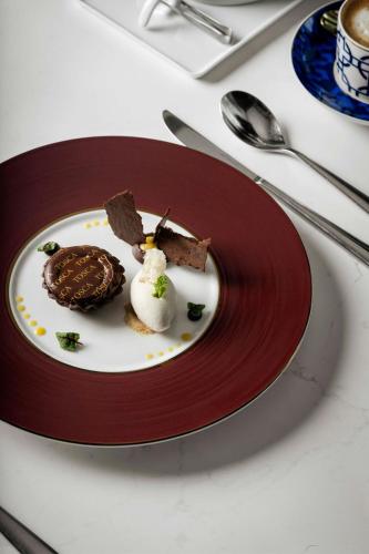 a plate of chocolate desserts on a table at The Ritz-Carlton, Hong Kong in Hong Kong