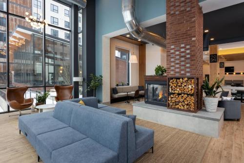 a living room with a couch and a fireplace at Residence Inn By Marriott Philadelphia Bala Cynwyd in Bala-Cynwyd