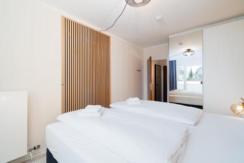 Ένα ή περισσότερα κρεβάτια σε δωμάτιο στο Das Solaris 7 Beach Apartment mit Balkon, Gemeinschaftssauna und Grillplatz