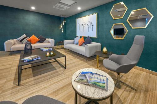 a living room with a couch and a table at City Express Plus by Marriott Ciudad de Mexico Interlomas in Mexico City