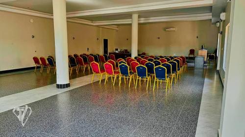 a room with a bunch of chairs in it at Tribu Hotels in Enugu