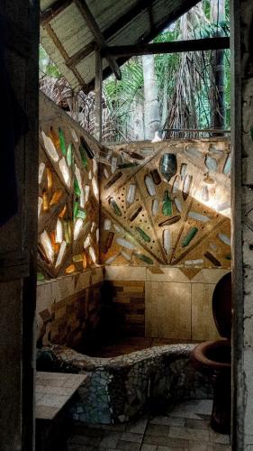 a stone wall with a fountain in a room at Viverde selva Redario natural in Alter do Chao