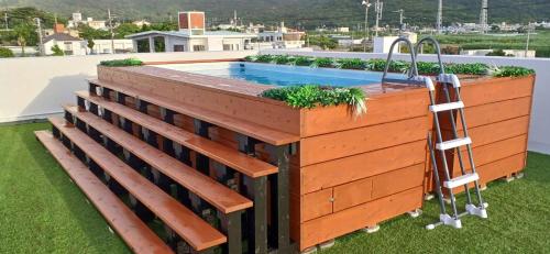 a pool deck with a sink on a roof at Resort House Ricca in Nanjo