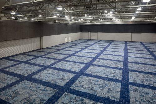 an empty room with a blue and white floor at Macon Marriott City Center in Macon