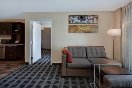a living room with a couch and a table at TownePlace Suites Las Vegas Airport South in Las Vegas