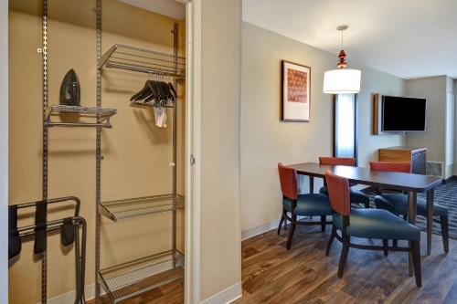 a dining room and kitchen with a table and chairs at TownePlace Suites Las Vegas Airport South in Las Vegas