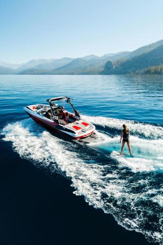 a person in a boat on a body of water at The Ritz-Carlton, Lake Tahoe in Truckee