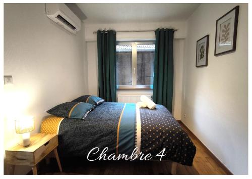 a bedroom with a bed and a window at Le Spacieux - centre-ville - 4 chambres - 8 pers in Sarreguemines