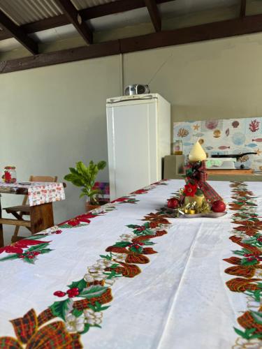 a bed with christmas ornaments on it in a room at Suite 3- Praia bonita Hospedagem,agora com ar condicionado in São Francisco do Sul