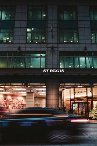 a building with a street sign in front of it at The St. Regis Toronto in Toronto