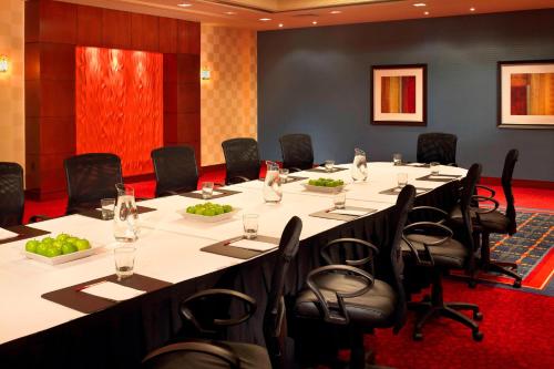 a conference room with a long table and chairs at Marriott Kansas City Overland Park in Overland Park