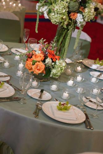 a table with a vase of flowers on it at Marriott Kansas City Overland Park in Overland Park