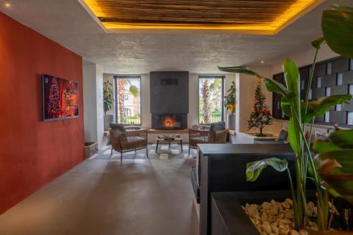 a living room with red walls and a fireplace at Ayvalık Sea Long in Ayvalık