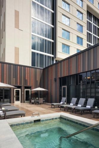 a swimming pool in front of a building at The Westin Jackson in Jackson