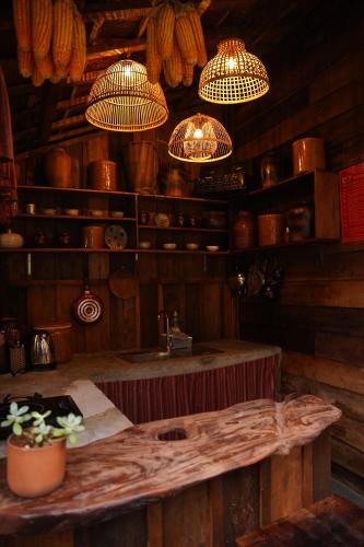a kitchen with a sink and chandeliers at Ôna's House - Homestay Pleiku in Pleiku