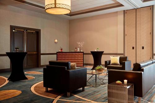 a lobby with chairs and a waiting room at Baltimore Marriott Inner Harbor at Camden Yards in Baltimore