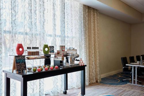 a room with a table in front of a window at Baltimore Marriott Inner Harbor at Camden Yards in Baltimore