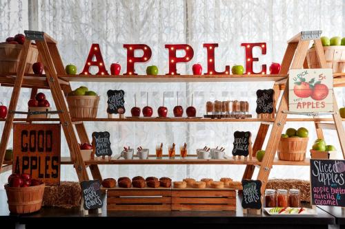 a shelf with apples and other food items on it at Baltimore Marriott Inner Harbor at Camden Yards in Baltimore