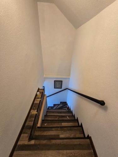 a set of stairs in a room with blue lighting at Vikendica u Banoštoru in Banoštor