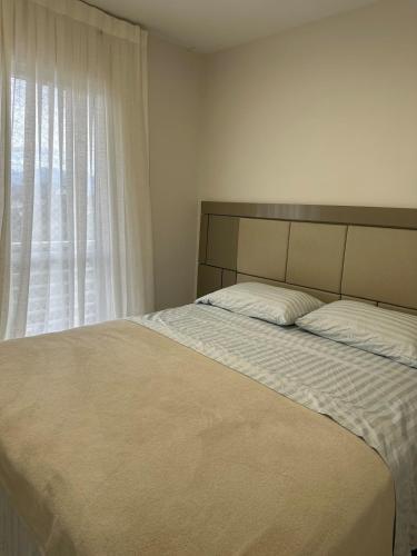 Ένα ή περισσότερα κρεβάτια σε δωμάτιο στο Apartamento Bairro Floresta