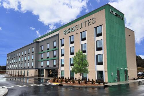 a building with a bunch of birds in front of it at ECHO Suites Extended Stay by Wyndham Nashville/ Gallatin in Gallatin