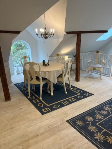 a dining room with a table and chairs at Ved Holckenhavn Fjord in Nyborg