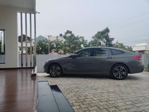 a gray car parked on the side of a house at Wind Chimes in Tiruvannāmalai