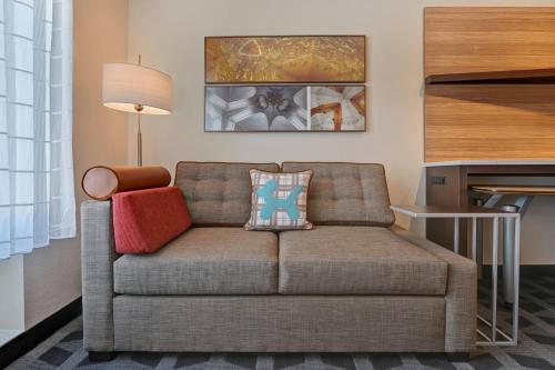 a living room with a couch and a table at TownePlace Suites by Marriott El Paso East/I-10 in El Paso