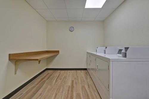 an empty room with white walls and wooden floors at TownePlace Suites by Marriott El Paso East/I-10 in El Paso