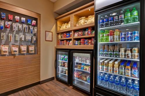 a refrigerator filled with lots of different types of drinks at TownePlace Suites by Marriott El Paso East/I-10 in El Paso