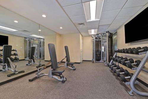 a gym with several chairs and a flat screen tv at TownePlace Suites by Marriott El Paso East/I-10 in El Paso