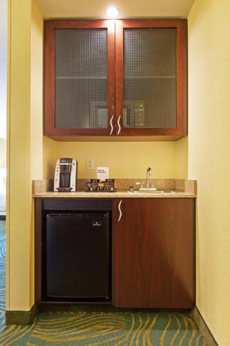 a kitchen with a sink and a counter top at SpringHill Suites Charlotte Lake Norman/Mooresville in Mooresville