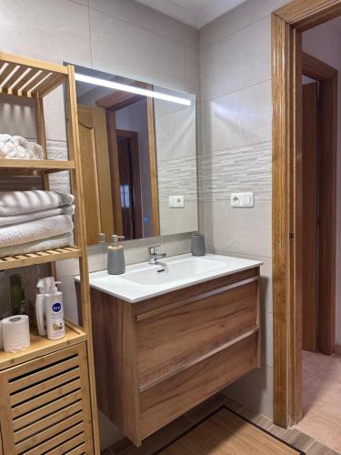 a bathroom with a sink and a mirror at Bungalow Carabassi Mediterraneo 3 Pool and roof terrace in Puerto Marino