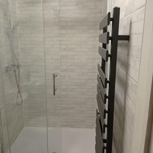 a bathroom with a shower with a glass door at En-suite Double Room 277GC2 Salford Manchester in Manchester