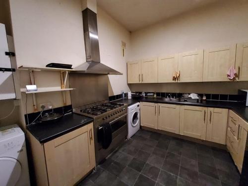 a kitchen with a stove and a stove top oven at En-suite Double Room 277GC2 Salford Manchester in Manchester