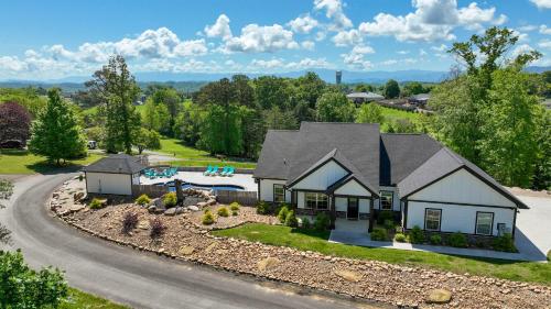 an aerial view of a house with a pool at H2Oasis Incredible Pool Retreat With Mountains Views! in Sevierville