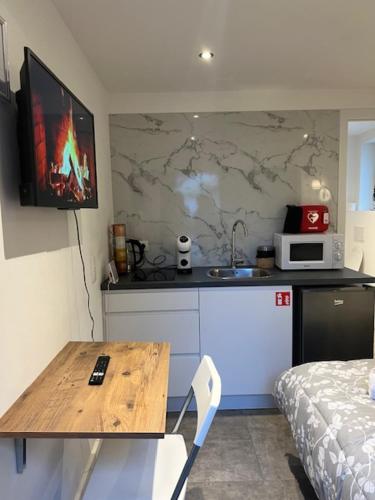 Kuchyň nebo kuchyňský kout v ubytování Cosy