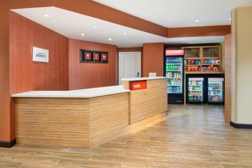 a store lobby with a counter in a store at TownePlace Suites Atlanta Lawrenceville in Lawrenceville