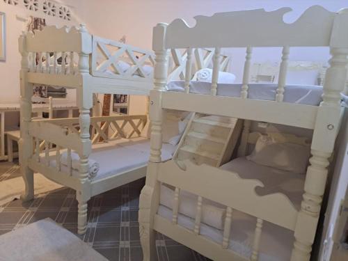 a couple of bunk beds in a room at Nyumba Tulivu in Watamu