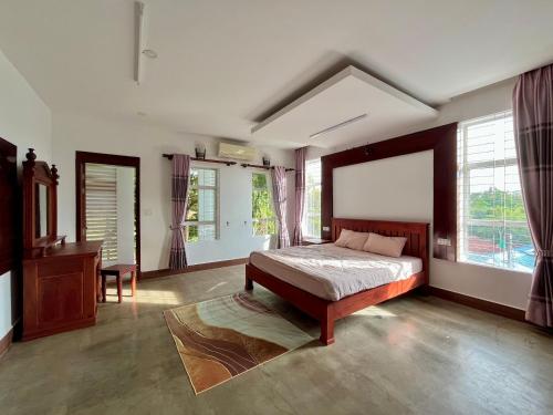 Postel nebo postele na pokoji v ubytování Canopy Residence