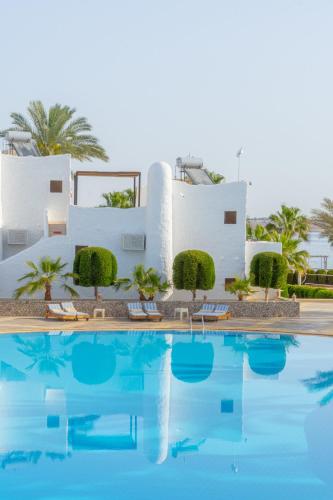 a view of the villa from the swimming pool at Sharm Club Beach Resort in Sharm El Sheikh
