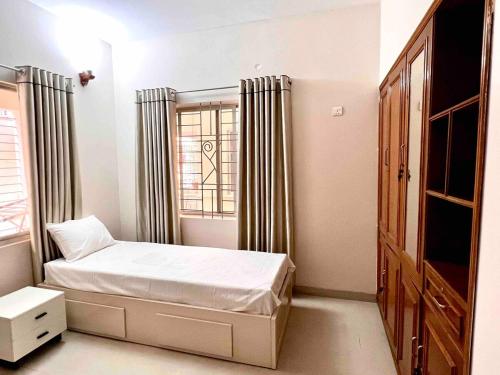 Katil atau katil-katil dalam bilik di Trips Trilogy Gulshan Apartmet