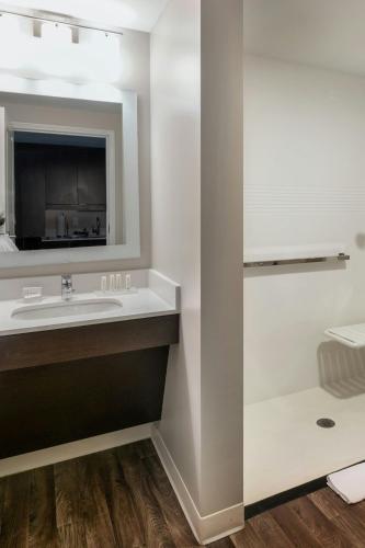 a bathroom with a sink and a mirror at TownePlace Suites by Marriott Milwaukee Oak Creek in Oak Creek