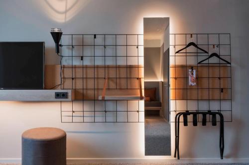 Телевизор и/или развлекательный центр в Moxy Frankfurt City Center