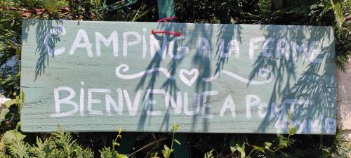 a sign with graffiti on the side of it at Trappeur in Le Fay