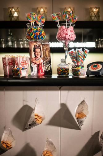 a table with a bunch of candies and other snacks at Le Méridien Vienna in Vienna